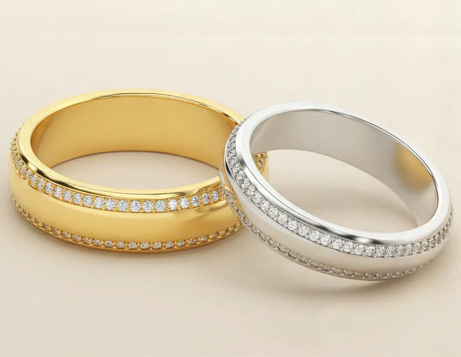 Yellow gold and white gold diamond-accented wedding bands displayed together.