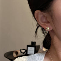 Geometric Gold and Silver Oval Stud Earrings