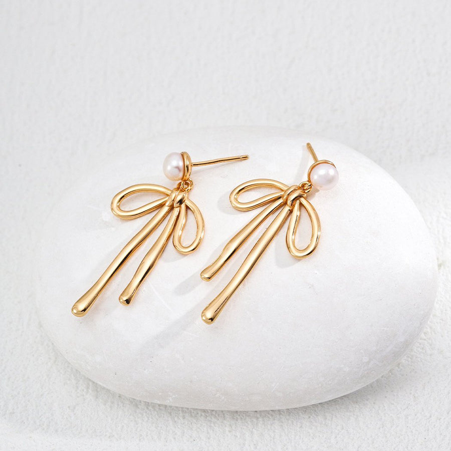 Natural Pearl Bow Earrings in Sterling Silver