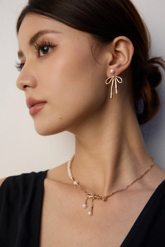 Natural Pearl Bow Earrings in Sterling Silver