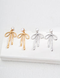 Natural Pearl Bow Earrings in Sterling Silver
