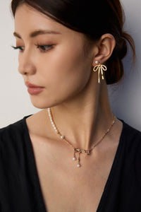 Natural Pearl Bow Earrings in Sterling Silver