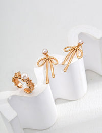 Natural Pearl Bow Earrings in Sterling Silver