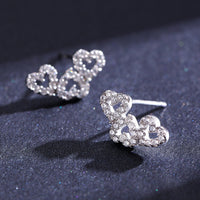 Sterling Silver Hollow Three Heart Stud Earrings