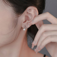 Shell Pearl Bowknot Stud Earrings in Sterling Silver