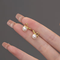 Shell Pearl Bowknot Stud Earrings in Sterling Silver